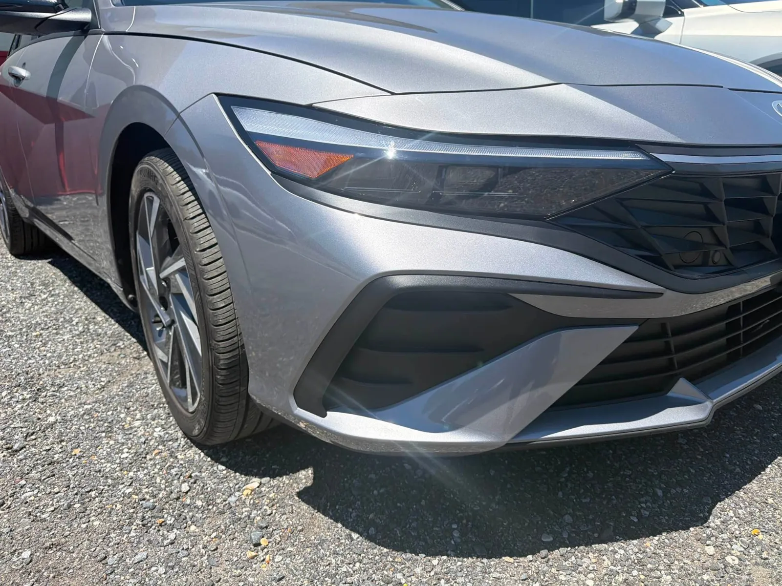 Silver Hyundai Elantra after repair, front bumper and headlight area restored