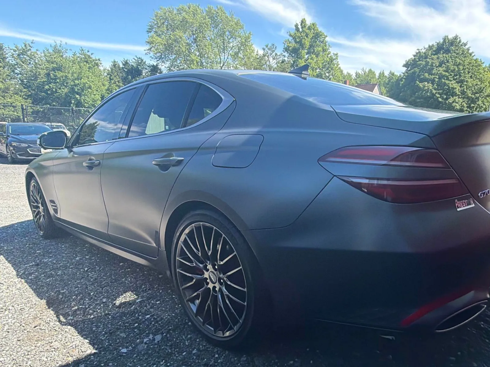 Gray Genesis G70 sedan after repair, rear bumper refinished