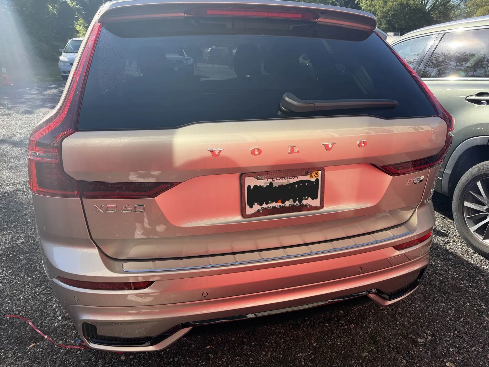 Champagne Volvo SUV after repair, liftgate and rear bumper restored